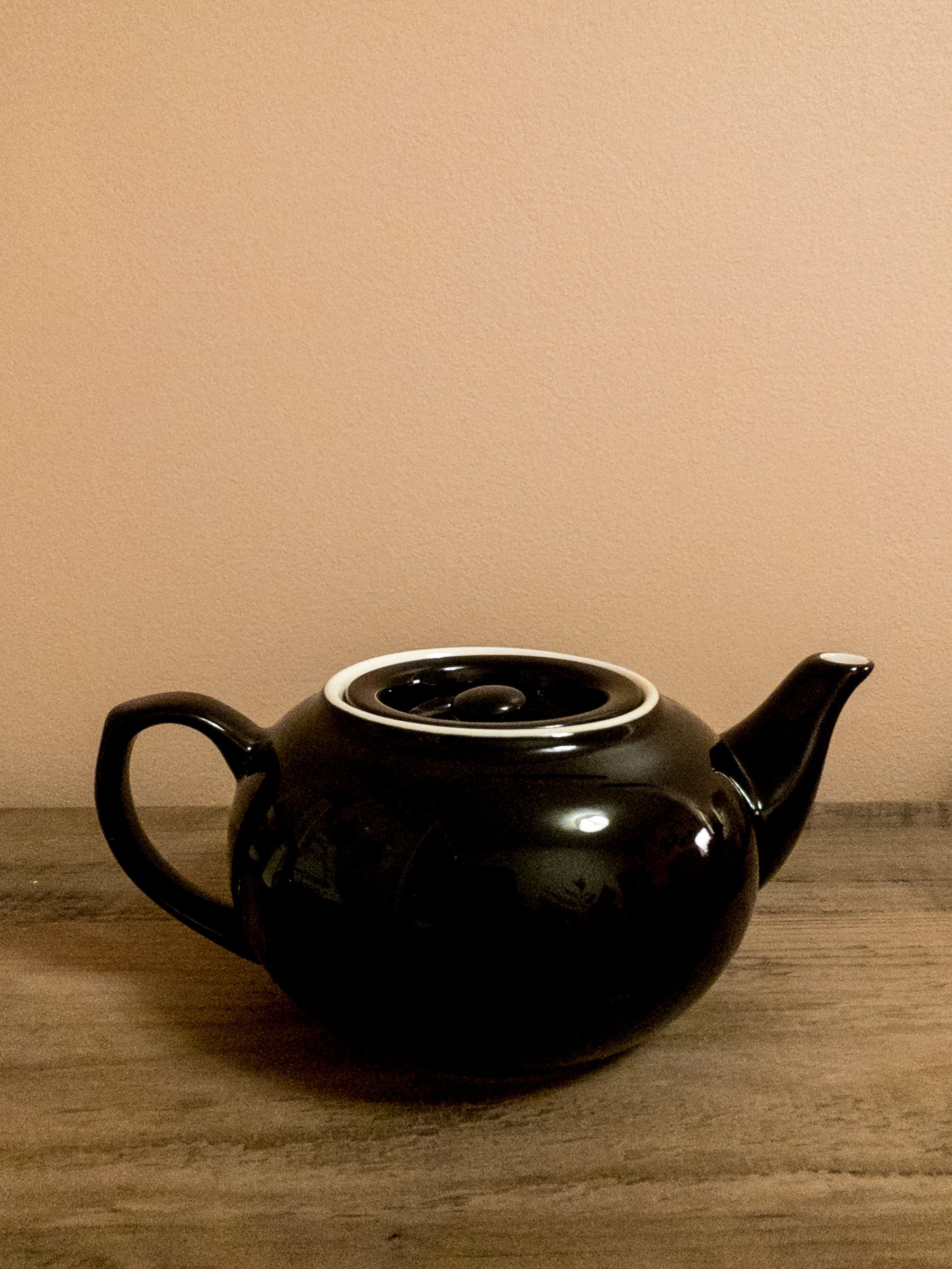 Black ceramic teapot.