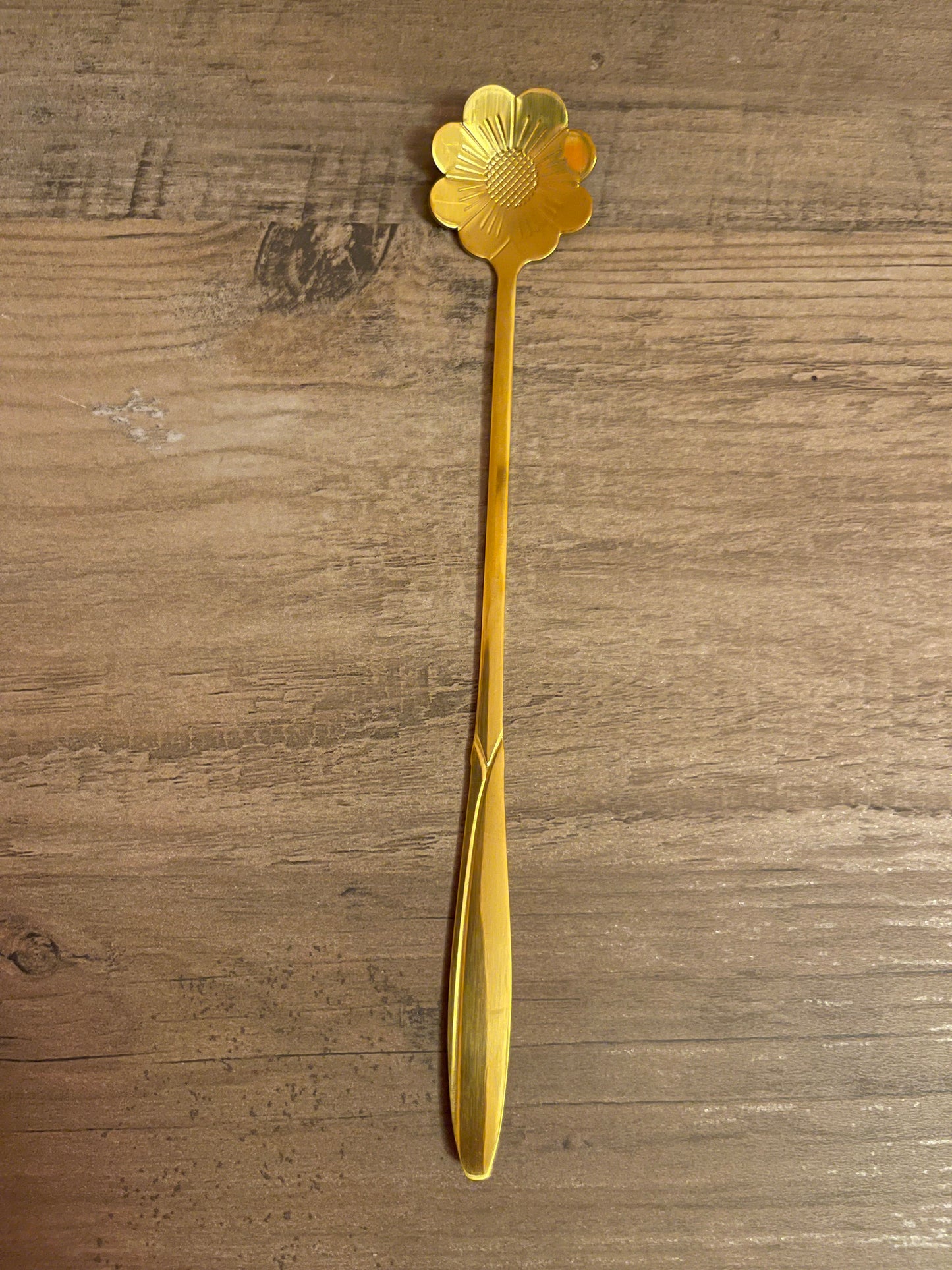 Gold cherry blossom teaspoon.