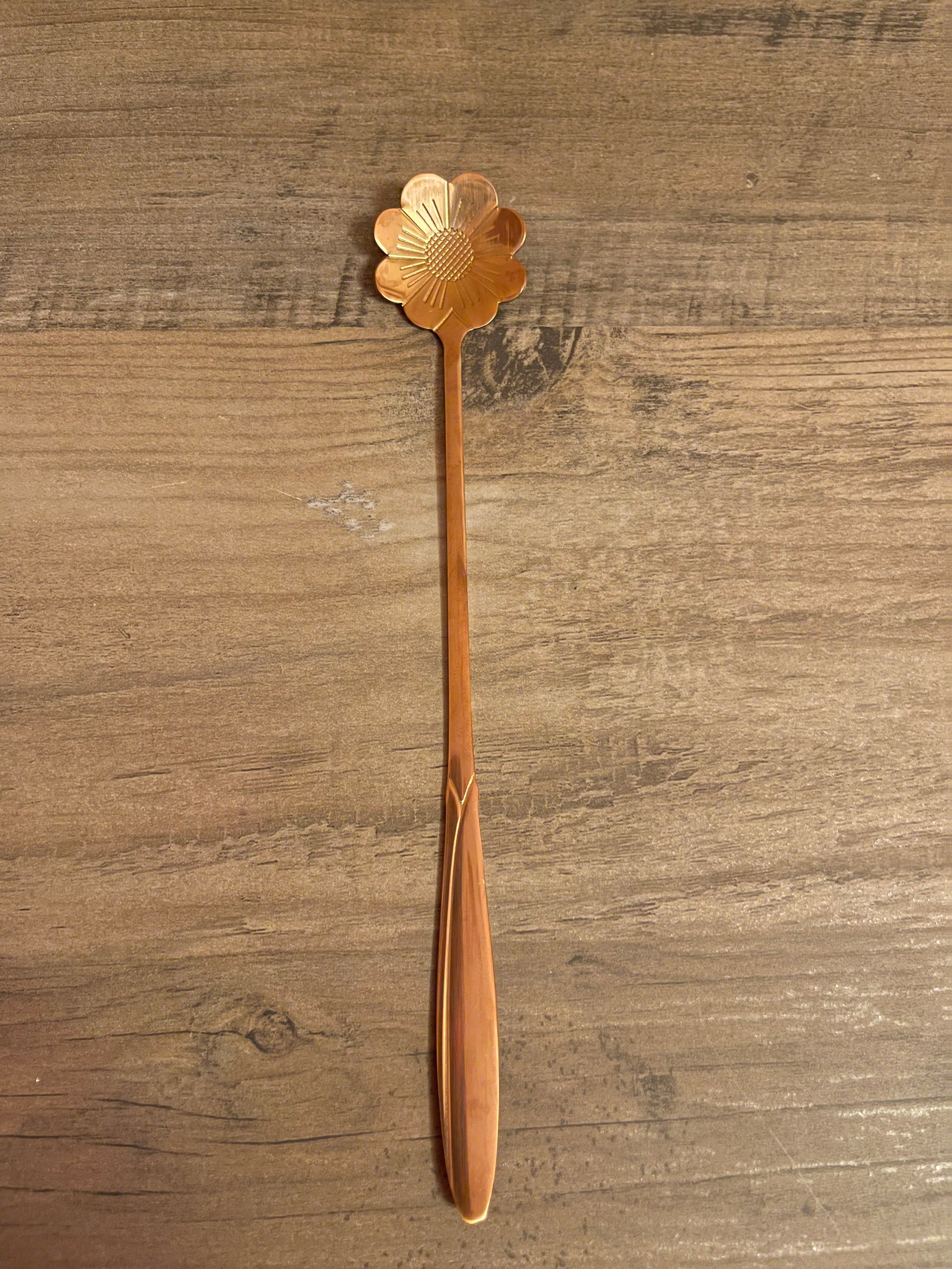 Rose gold daisy teaspoon.