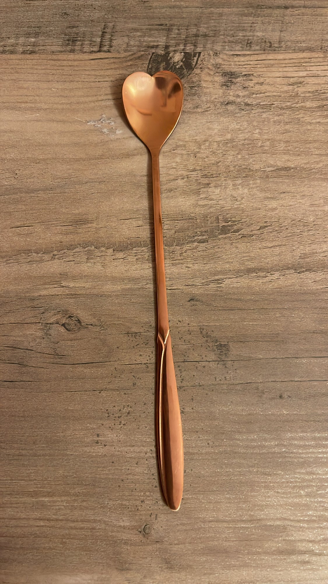 Rose gold heart-shaped spoon.