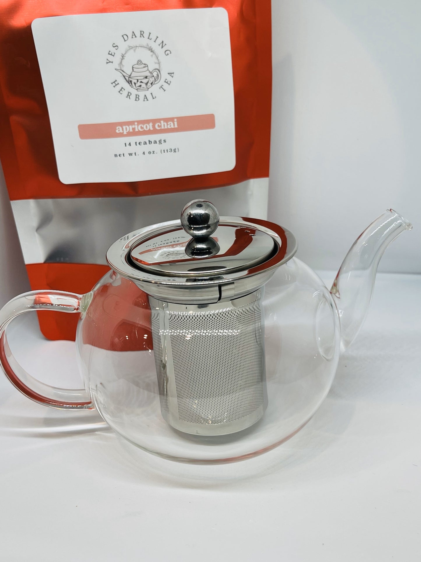 Clear glass tea pot with stainless steel infuser.