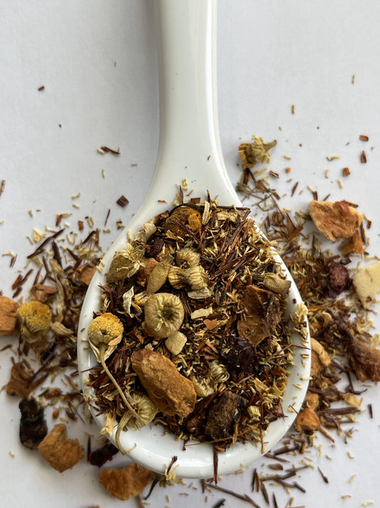 Herbal tea blend with Egyptian chamomile, South African rooibos, fresh peppermint leaves, apple pieces, freeze-dried cranberry slices, and coconut flakes.